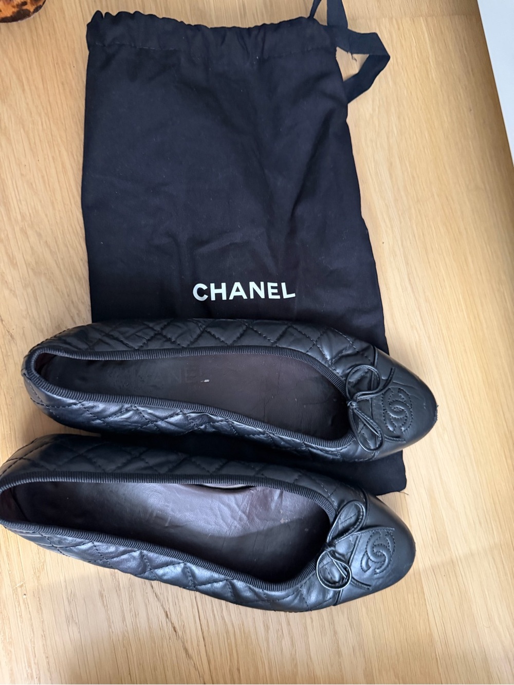 CHANEL Black Quilted Leather Ballet Flats with CC Medallion